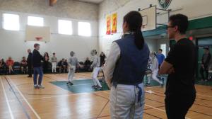 coaching advice at a fencing tournament